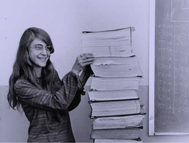 Margaret Hamilton holding several files